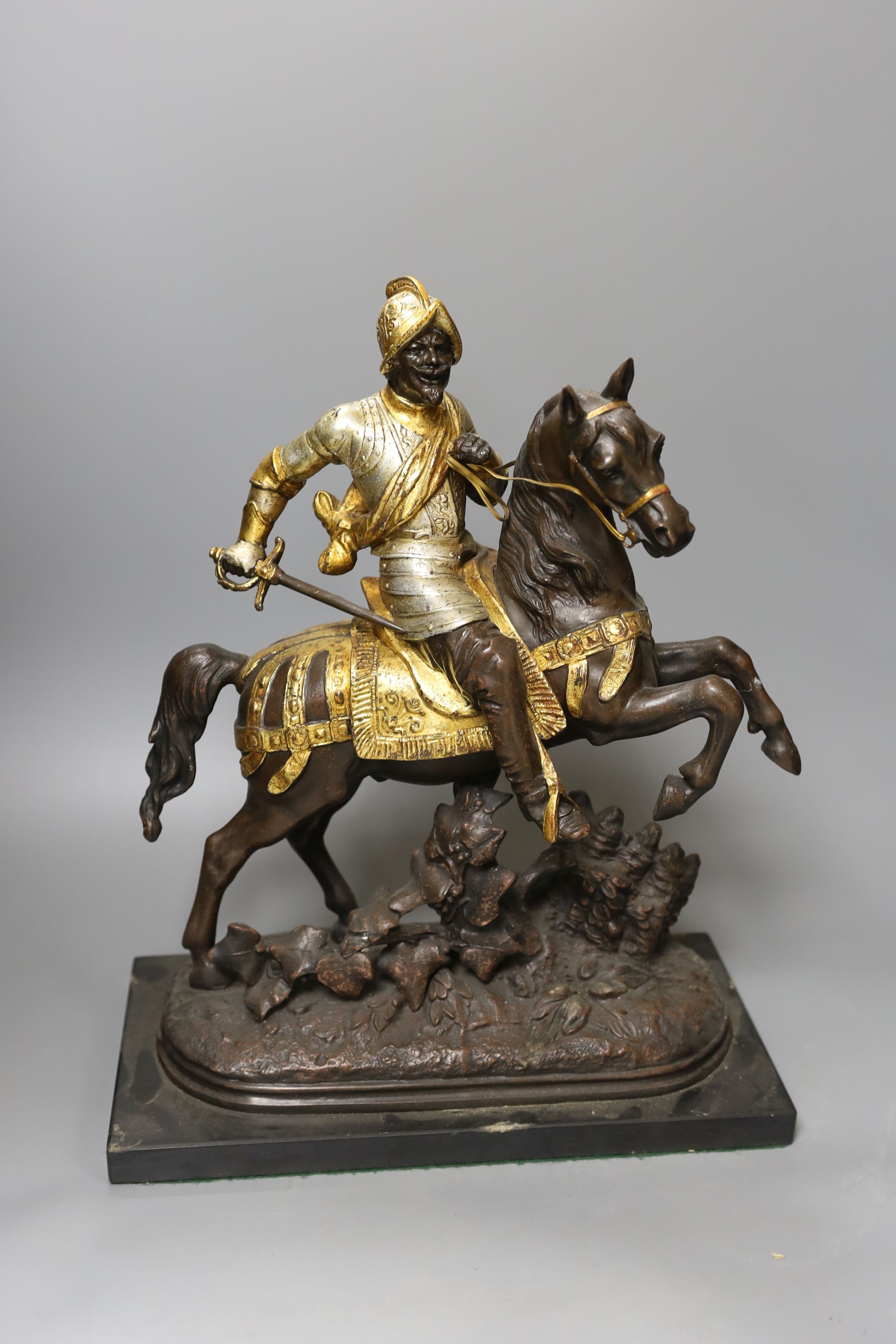 Three spelter warriors on horseback - tallest 43cm